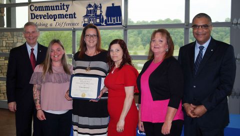 Clarksville Mayor Joe Pitts and Keith Lampkin, director of the Clarksville Office of Housing & Community Development, present a Certificate of Appreciation to the the Urban Ministries on Thursday at a breakfast  to honor  Clarksville’s service providers who fight homelessness and hunger. 