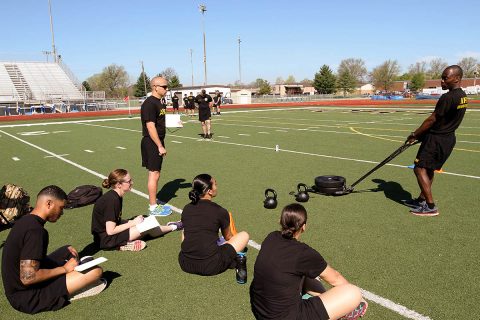 Sgt. 1st Class Tony Husbands, an instructor with the ACFT Mobile Training Team, instructs Soldiers from the 101st Airborne Division (Air Assault) how to properly grade the Sprint, Drag and Carry event at Fryar Stadium on Fort Campbell, KY., April 9th. (U.S. Army Photo by Spc. Andrew Jo)