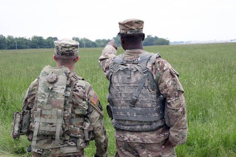 Capt. Andrew Paulin (left), company commander of the Headquarters and Headquarters Company, ‘Angry Dogs’, 101st Special Troops Battalion, 101st Sustainment Brigade, 101st Airborne Division (Air Assault), and 1st Sgt. Antodd Richards (right), first sergeant of HHC, discuss the location of where to set up the Tactical Operations Center Exercise for the upcoming week’s training exercise, May 6, 2019, on Fort Campbell, Ky. (Staff Sgt. Caitlyn Byrne, 101st Sustainment Brigade Public Affairs) 