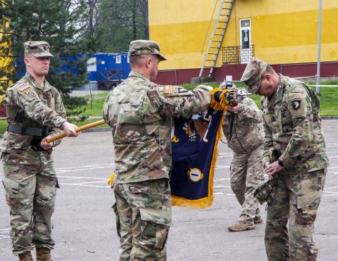 Lt. Col. Michael Starz, Commander (left), and Command Sgt. Maj. Michael Manley, Command Sergeant Major (right), uncased their unit colors during a ceremony here, May 2. (Sgt. Justin Navin, 2nd Brigade Combat Team, 101st Airborne Division (AA) Public Affairs)