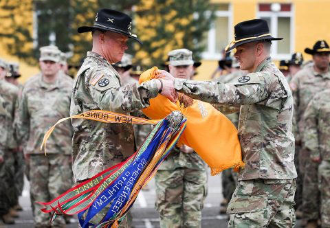 Lt. Col. Timothy Cleveland, Commander (left), and Command Sgt. Maj. Dale Crockette, Command Sergeant Major, of 278th Calvary Regiment, Tennessee Army National Guard (right), case their unit colors here, May 2. (Sgt. Justin Navin, 2nd Brigade Combat Team, 101st Airborne Division (AA) Public Affairs)