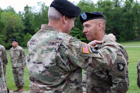 Maj. Gen. Brian Winksi, commanding general, 101st Airborne Division (Air Assault), pins Air Assault wings on Command Sgt. Maj. Bryan Barker, senior enlisted advisor for 101st Airborne Division May 10 at Fort Campbell, Kentucky. (Sgt. First Class Carlos Davis, 101st Airborne Division)