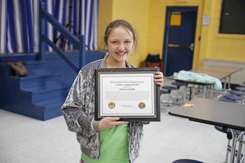 Hailie Latham with her Clarksville Police Department Citizen Citation.