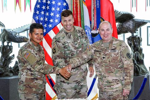 Col. Clair Gill (center), 101st Airborne Division (Air Assault) Deputy Commander, Support, is joined by Fort Campbell's oldest Soldier, Lt. Col. John McDonough (right), assigned to Blanchfield Army Community Hospital, and youngest Soldier, Pvt. Justin Davila (left), of 2nd Battalion, 44th Air Defense Artillery Regiment for a cake cutting ceremony marking the 244th Army Birthday. (Pfc. John Simpson, 101st Airborne Division)