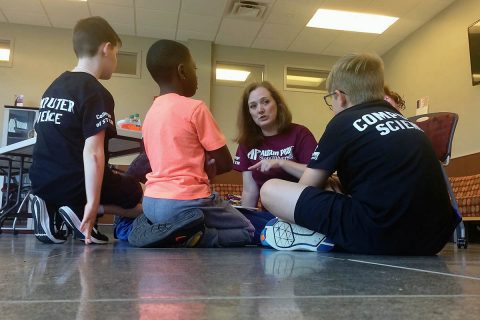 Bridget Cloud teaches the young coders how to program their robots at Austin Peay State University. (APSU)