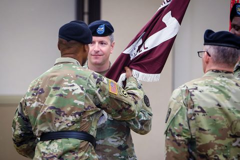 Col. Anthony McQueen relinquishes command of U.S. Army Medical Department Activity-Fort Campbell to Col. Patrick Birchfield during a change of command ceremony June 17. Brig. Gen. Michael J. Talley, Deputy Commanding General of Regional Health Command-Atlantic, passes the hospital colors to Birchfield, symbolizing the transfer of command responsibility. (David E. Gillespie)