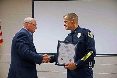 Clarksville Police Chief Al Ansley (R) shakes Deputy Chief Mike Parr (L) hand at his retirement ceremony.