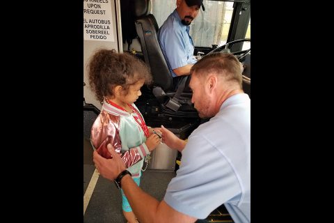 Paul Nelson, Clarksville Transit System transportation manager, explains to a girl how to navigate the transit system during the BELL Academy, a National Federation of the Blind program hosted June 3-7 at APSU. More than 15 participants with varying degrees of vision loss received training on how to navigate the transit system as part of the camp, which included arts and crafts, sports and recreational activities, community field trips, and other fun activities. (CTS)