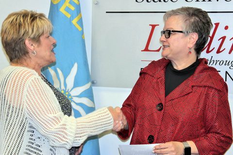 Edelweiss Club President Mary Ann Miner presents a gift to Austin Peay State University President Dr. Alisa White to create the Edelweiss Club of Clarksville German Endowment. (APSU)