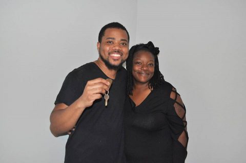 Mario Owens and Overlia Williams with the key to their new home.