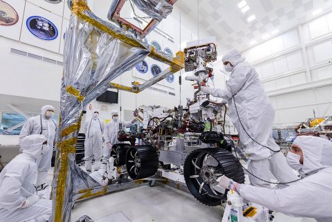 In this image, taken on June 13th, 2019, engineers at JPL install the starboard legs and wheels - otherwise known as the mobility suspension - on the Mars 2020 rover. (NASA/JPL-Caltech)