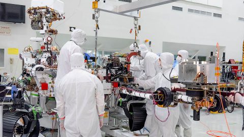 On June 21st, 2019, engineers at NASA's Jet Propulsion Laboratory install the main robotic arm on the Mars 2020 rover. Measuring 7 feet (2.1 meters) long, the arm will allow the rover to work as a human geologist would: by holding and using science tools with its turret. (NASA/JPL-Caltech) On June 21st, 2019, engineers at NASA's Jet Propulsion Laboratory install the main robotic arm on the Mars 2020 rover. Measuring 7 feet (2.1 meters) long, the arm will allow the rover to work as a human geologist would: by holding and using science tools with its turret. (NASA/JPL-Caltech)