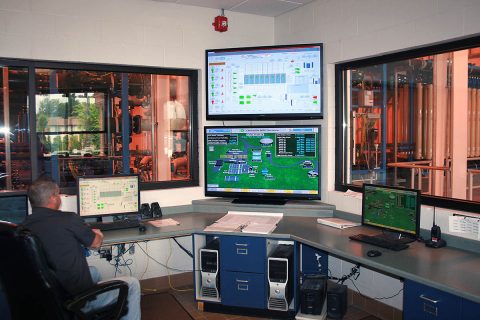 A Clarksville Gas and Water Department technician uses computers to monitor water operations at the Clarksville Water Plant. A Clarksville Gas and Water Department technician uses computers to monitor water operations at the Clarksville Water Plant.