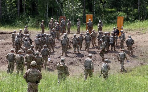 Iowa National Guard and 101st Airborne Division engineer Soldiers prepare to conduct a live urban breach during an eXportable Combat Training Capability rotation at Camp Ripley, Minn., on July 15, 2019. The National Guard and active duty units had the opportunity to train together as part of their working relationship. (Sgt. Tawny Schmit) 