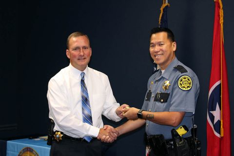 Montgomery County Sheriff John Fuson congratulates Sergeant Bishop Delaney.