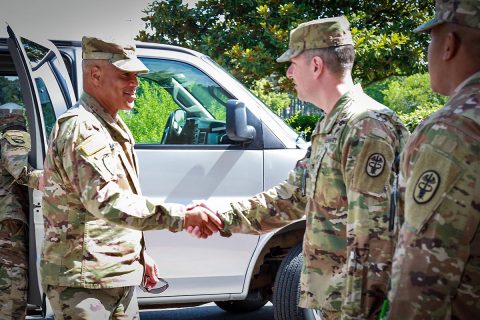 Col. Patrick T. Birchfield, center, Blanchfield Army Community Hospital commander, and Command Sgt. Maj. Christopher Earle, right, welcome Gen. Michael X. Garrett, U.S. Army Forces Command commander, to the hospital, June 25. (U.S. Army photo by David Gillespie)