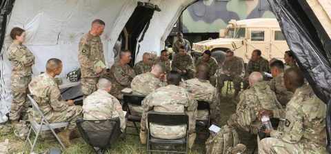 Lt. Col. R. Arron Lummer (center), commander of the 101st Special Troops Battalion, 101st Sustainment Brigade, conducts a battle update brief with his senior leadership in order to see how battalion sustainment field operations are going, August 6, 2019, on Fort Campbell, Kentucky. Lifeliners’ Soldiers are training in the field, participating in Eagle Talon II, a 10-day division-wide exercise, from August 5th to the 16th, designed to prepare Soldiers and leadership for the larger warfighter exercise, which will validate their warfighting skills as a complete fighting force. (Sgt. Aimee Nordin, 101st Sustainment Brigade Public Affairs) Lt. Col. R. Arron Lummer (center), commander of the 101st Special Troops Battalion, 101st Sustainment Brigade, conducts a battle update brief with his senior leadership in order to see how battalion sustainment field operations are going, August 6, 2019, on Fort Campbell, Kentucky. Lifeliners’ Soldiers are training in the field, participating in Eagle Talon II, a 10-day division-wide exercise, from August 5th to the 16th, designed to prepare Soldiers and leadership for the larger warfighter exercise, which will validate their warfighting skills as a complete fighting force. (Sgt. Aimee Nordin, 101st Sustainment Brigade Public Affairs)