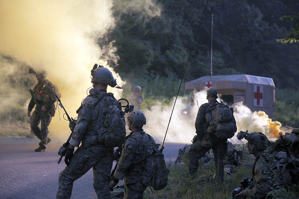 Green Berets from 5th Special Forces Group (Airborne), signal for an evacuation with soldiers of C Troop, 1st Squadron, 75th Cavalry Regiment, 2nd Brigade Combat Team, 101st Airborne Division, during the culminating event of a two-week exercise in the Fort Campbell training area on Friday, August 16, 2019. “Our goal was to do a week of SOP development, do small unit tactics and then take them through a planning process into operation,” said a Green Beret with 5th SFG(A). (U.S. Army photo by Staff Sgt. William Howard)