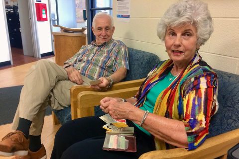 Drs. Harriet and Leon McQueen look through the billfold’s contents, untouched for nearly 32 years. (APSU)