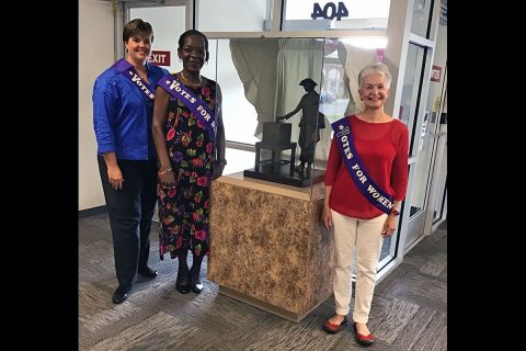 Steering Committee members Elizabeth Black, Khandra Smalley and Rosalind Kurita stand with the Tennessee Triumph maquette. 