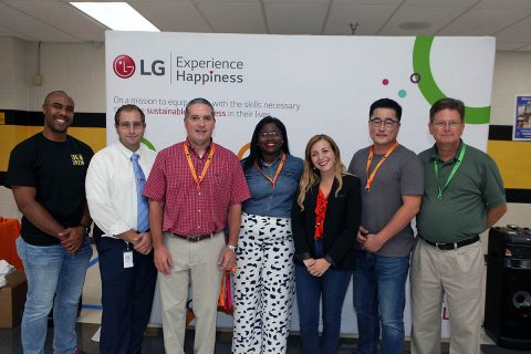 (L to R) Dr. Marlon Heaston, Kenwood Middle School Principal, Brian Litten, 8th Grade Social Studies Teacher & Football Assistant Coach; Ted Myers, LG Strategic Planning Manager: Arnitia Goodman, LG Recruiting Specialist; Laura Barbieri, Manager, CSR & Community Relations; Geewoo Kim, LG Office Administrator; David Mark,LG Senior Procurement Manager. (Tony Centonze)