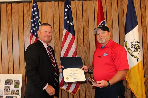 Montgomery County Mayor Jim Durrett congratulates Paramedic Russell “Andy” Merritt from the Montgomery County Emergency Medical Services.