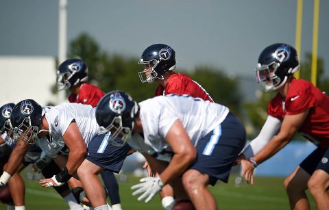 Tennessee Titans quarterback Ryan Tannehill (17) stands under center as quarterback Marcus Mariota (8) and quarterback Logan Woodside (5) run drills at St. Thomas Sports Park. (Steve Roberts-USA TODAY Sports)