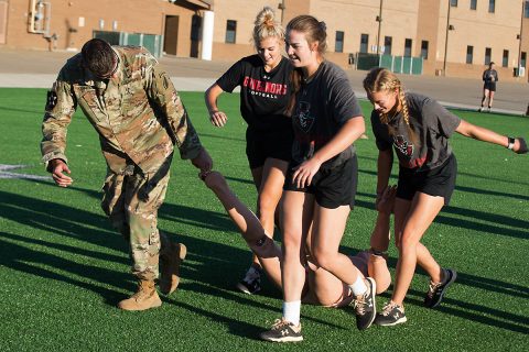 Austin Peay State University’s softball team participates in a simulated casualty drag with 5th Special Forces Group (Airborne) soldiers at Fort Campbell, Ky., Friday, Oct. 18, 2019. These events were designed to develop soldier like teamwork within the team. (Sgt. Christopher Roberts) 