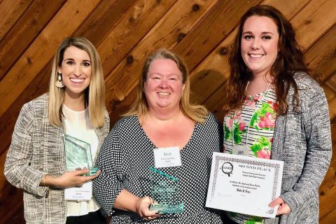 Austin Peay State University’s Rebecca Rider, from the left, Dr. Tracy Nichols and Hailey Perry show off their conference awards. (APSU)