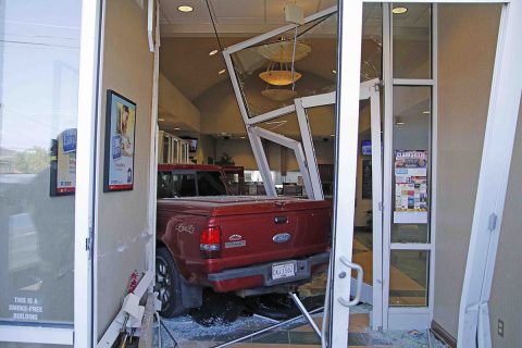 A pickup truck crashed into the front doors of F&M Bank on Madison Street today. (Jim Knoll, CPD)