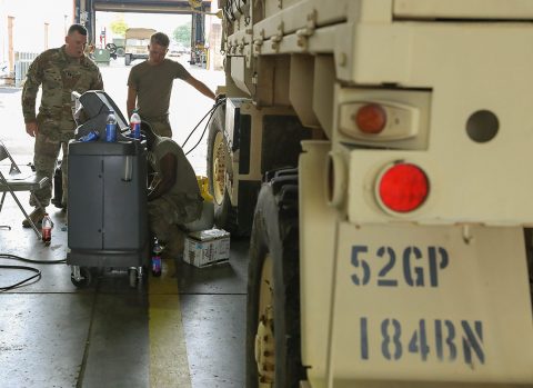 Cpt. Michael Knight, commander, 584th Support Maintenance Company, 101st sustainment Brigade talks to soldiers about vehicle maintenance. The soldiers are troubleshooting the wheel tire pressure on a Light Medium Tactical Vehicle belonging to 52nd Ordnance Group, 184th Ordnance Battalion. (Sgt. Aimee Nordin, 101st Airborne Division (AA) Sustainment Brigade Public Affairs)