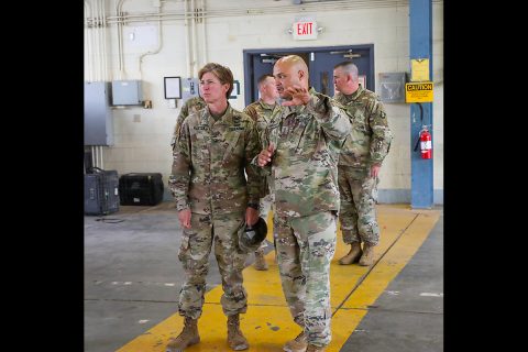 Chief Warrant Officer 4 Langston Washington (right), Senior Warrant Officer, 101st Sustainment Brigade, 101st Airborne Division (Air Assault), explains to Col. Stephanie Barton (left), commander 101st Sust. Bde., the overview of the logistics portion of Operation Eagle Wrench. (Sgt. Aimee Nordin, 101st Airborne Division (AA) Sustainment Brigade Public Affairs)