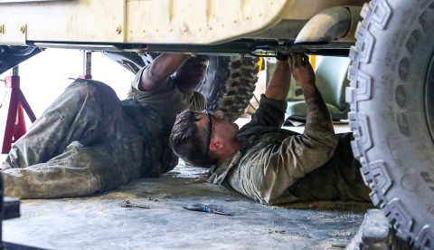 Spc. Cory Bowden (right), Forward Support Company, 326th Brigade Engineer Battalion, 1st Brigade Combat Team, 101st Airborne Division (Air Assault) works along with Soldiers of various brigades to improve vehicle readiness. Bowden expressed he has learned to work on new vehicles, even ones he has not worked on before. (Sgt. Aimee Nordin, 101st Airborne Division (AA) Sustainment Brigade Public Affairs)