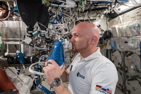 ESA (European Space Agency) astronaut Alexander Gerst exhales into an ultra-sensitive gas analyzer for the Airway Monitoring experiment, a study of airway inflammation in crew members. Results help flight surgeons plan safer long-term missions to the Moon and Mars and may help patients on Earth with asthma or other airway inflammatory diseases. (NASA)