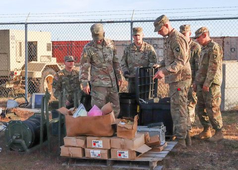 Soldiers from varying brigades and units throughout the 101st Airborne Division (Air Assault) sort through excess supplies and equipment brought in to the Division Excess Consolidation Point (DECP), Nov. 20, as part of Operations Clean Eagle and Eagle Sweep. (Staff Sgt. Caitlyn Byrne, 101st Sustainment Brigade Public Affairs) 