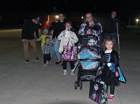 Lifeliners Soldiers and Family members walk together to the next spookily decorated vehicle, during the 101st Sustainment Brigade, 101st Airborne Division (Air Assault) Trunk-or-Treat event, here on Fort Campbell, KY, October 29, 2019. Over twenty different vehicles showed up and showed out at the event, displaying their trunks and decorating skills with a multitude of fun and spooky Halloween themes. (Staff Sgt. Caitlyn Byrne, 101st Sustainment Brigade Public Affairs) 