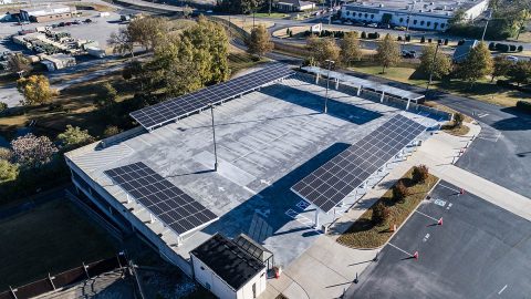 Aerial view of a state-of-the-art Solar Photovoltaic system parking canopy recently installed on the upper deck of the garage at Joint Force Headquarters, Tenn. National Guard in Nashville, November 6, 2019. The system has the generating capacity of 106.6 kilowatts (kW) which can provide approximately twenty percent of the Headquarters building power needs. (Sgt. Robert Mercado)