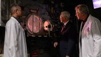 U.S. Vice President Mike Pence (center) views a test run at the Arc Jet Complex at NASA’s Ames Research Center in California’s Silicon Valley on Thursday, Nov. 14, 2019. Also pictured are Arc Jet Complex facility manager Peter Race (left) and Ames’ Thermophysics Facilities Branch chief Scott Eddlemon (right). (NASA/Dominic Hart)