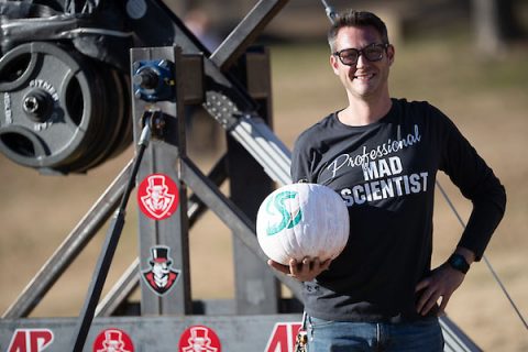 Austin Peay State University's Bryan Gaither and a Sacramento State pumpkin. (APSU)