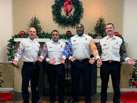 Clarksville Fire Rescue Chief Freddie Montgomery, third from left, shows off his holiday party sleeves -- one for Kentucky and one for Tennessee -- along with other honorees Saturday at the Hopkinsville Fire Department’s annual award ceremony. HFD announced the Montgomery Award in his honor during the event.