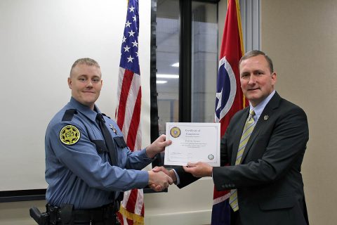 Montgomery County Sheriff John Fuson congratulates Collin Trout.