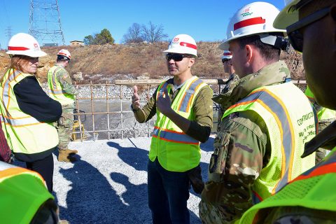 Jeremiah Manning, resident engineer for the Kentucky Lock Addition Project explains construction of the downstream coffer dam with concrete shells that will also be part of the permanent lock wall to combat engineers from Fort Campbell’s 326th Engineer Battalion, 101st Airborne Division during a tour at the Kentucky Lock Addition Project in Grand Rivers, KY. (Mark Rankin, U.S. Army Corps of Engineers, Nashville District)