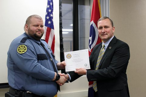 Montgomery County Sheriff John Fuson congratulates Michael Wall.