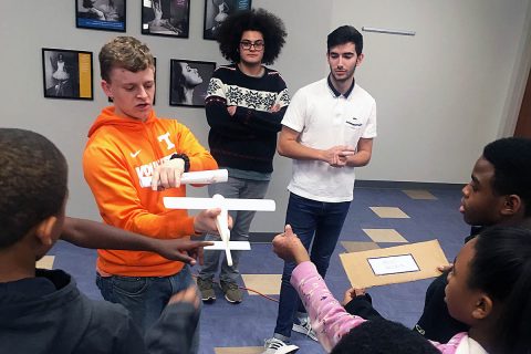 Research students from the University of Tennessee, who during 2019 worked to design an ultra-efficient wing as part of the school’s University Leadership Initiative project, explain airplane control surfaces to students at the Regal Boys & Girls Club in Knoxville, TN. (Hans Sati Goertz, University of Tennessee)