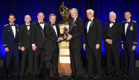 The Automatic Ground Collision Avoidance System Team accepted the Collier Trophy on June 13, 2019. From left to right: Col Robert Ungerman, Mark Skoog, Ed Griffin, Mark Wilkins, Jim Albaugh, Greg Principato, Donald Swihart, and Lt Col Tucker Hamilton. (National Aeronautic Association)