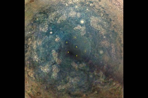 This composite visible-light image taken by the JunoCam imager aboard NASA's Juno spacecraft on Nov. 3, 2019, shows a new cyclone at Jupiter's south pole has joined five other cyclones to create a hexagonal shape around a large single cyclone. (NASA/JPL-Caltech/SwRI/MSSS/JunoCam)