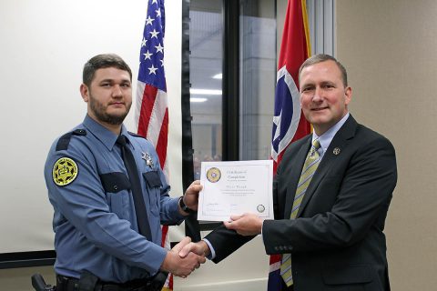 Montgomery County Sheriff John Fuson congratulates Tyler Waugh. Montgomery County Sheriff John Fuson congratulates Tyler Waugh.