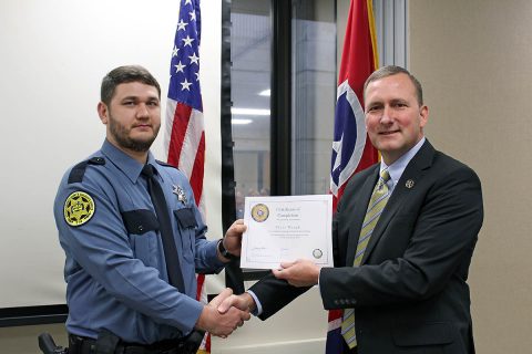 Montgomery County Sheriff John Fuson congratulates Tyler Waugh.