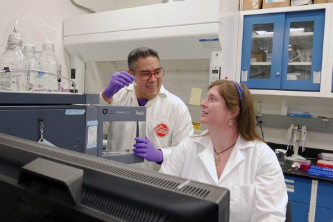 Jose Aponte and Hannah McLain work in the Astrobiology Analytical Laboratory at NASA's Goddard Space Flight Center. The scientists who work in this lab analyze amino acids in Apollo samples, meteorites, and comet dust — in other words, in well-preserved remnants of the early solar system. (NASA's Goddard Space Flight Center/Molly Wasser)