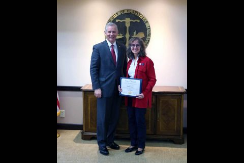 Clarksville Mayor Joe Pitts presents Cinde Jones with certificate of appreciation for her work with Quilts of Valor, Clarksville.